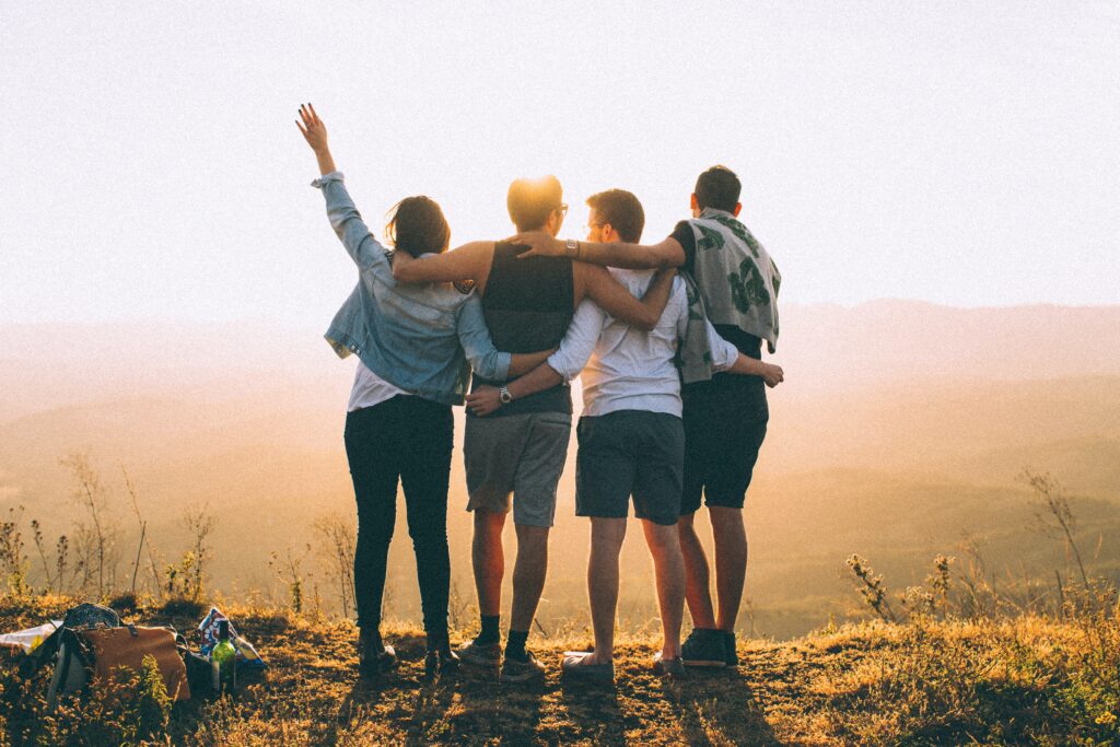 MBSR_1 4 people arm in arm facing sunset